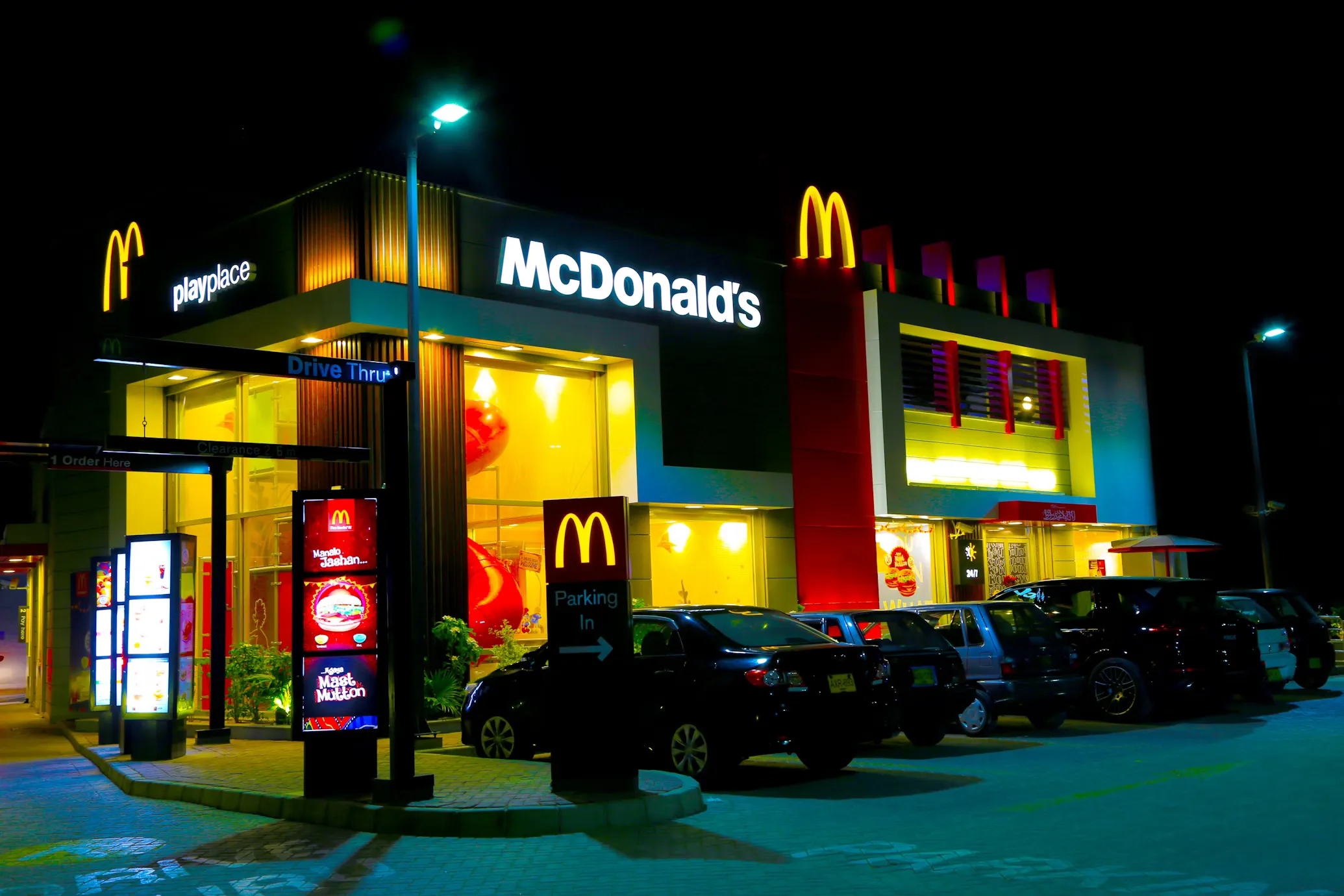 A fully branded restaurant with lit signage at night