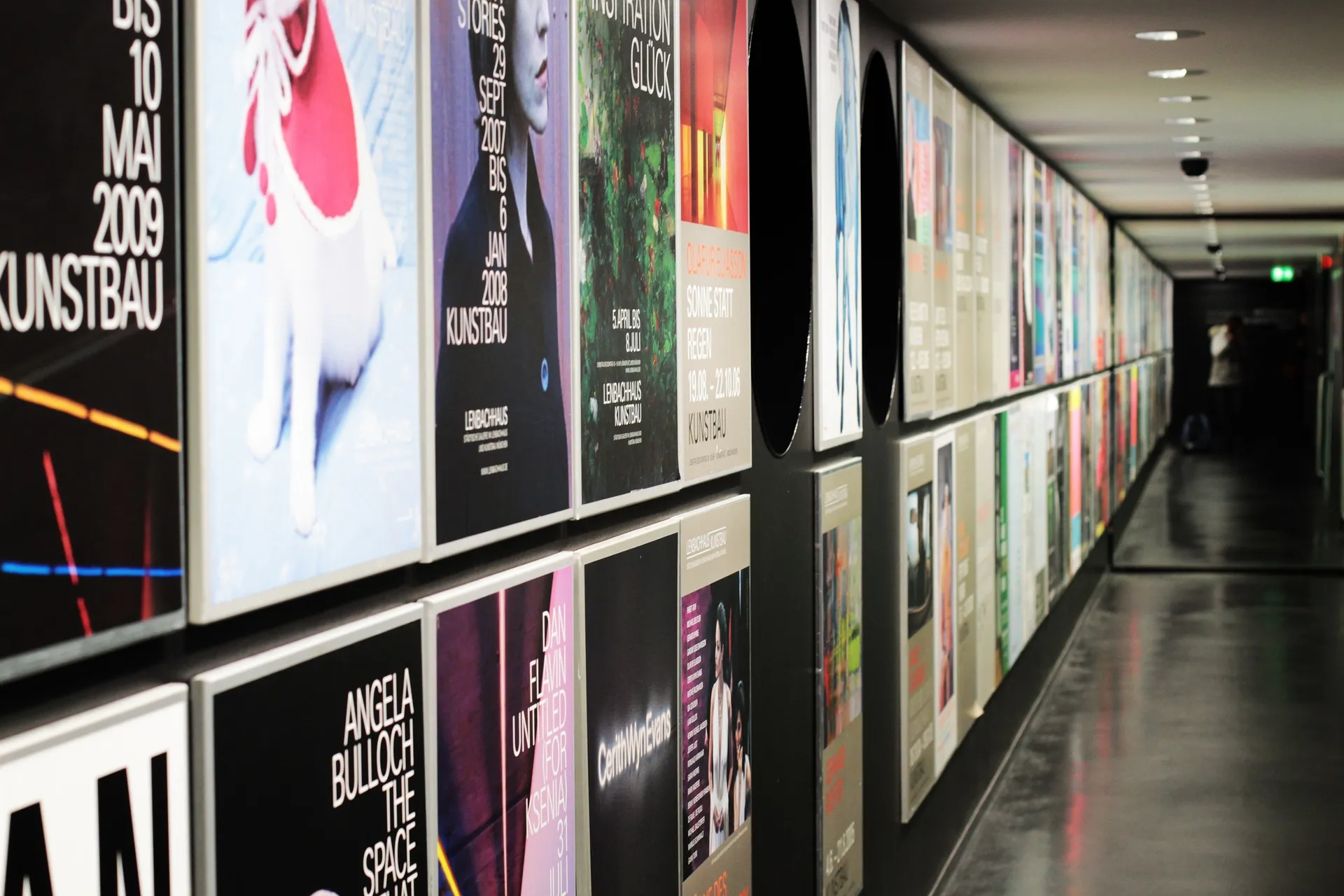 Corridor lined with backlit brand graphics