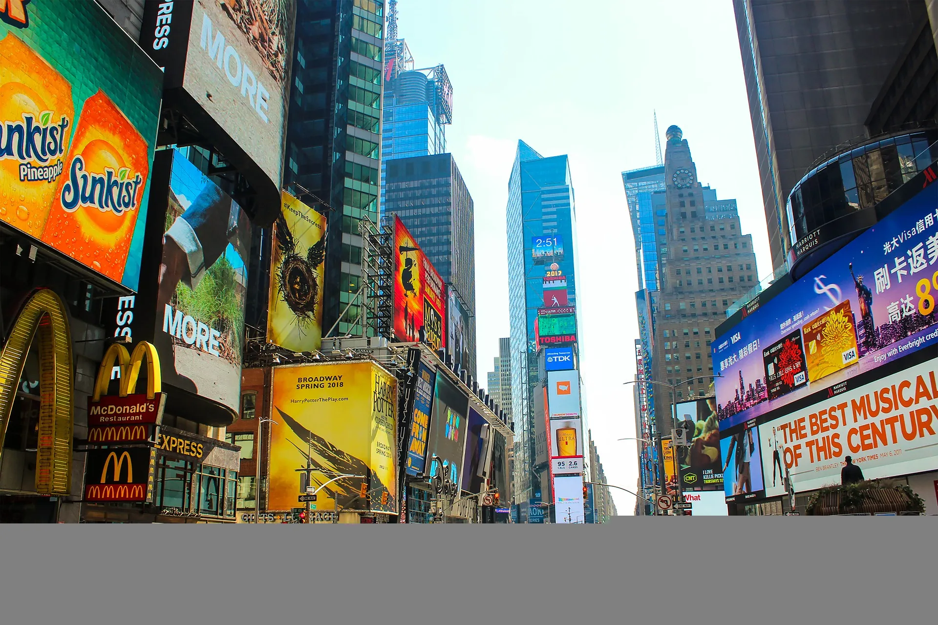 Dense street of large illuminated billboards