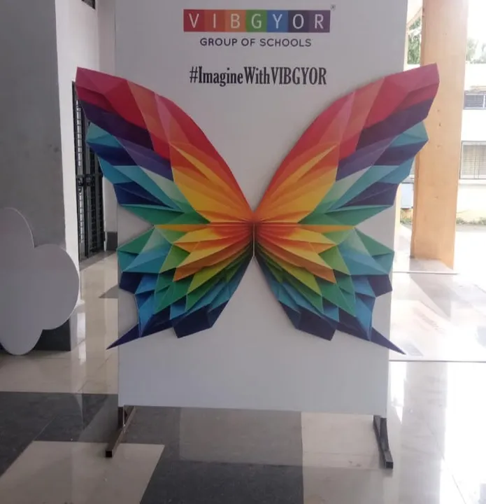 Large printed butterfly installation at a school