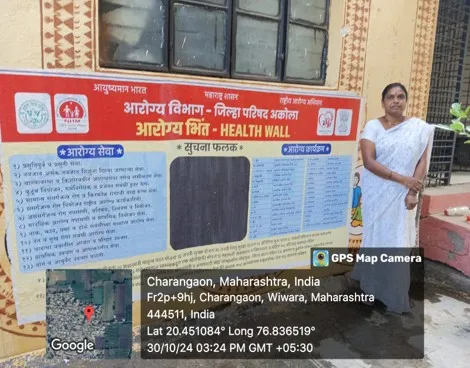 A village wall painted with a public information campaign